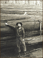 Logger in front of red cedar tree 